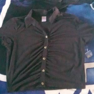 Extremely soft black button up tee. Made smaller than tag reads.